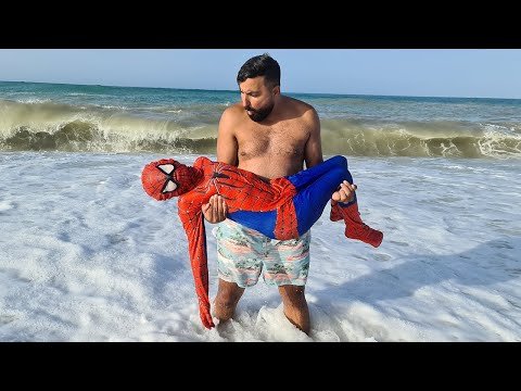 kids find superhero Spider-Man on the beach